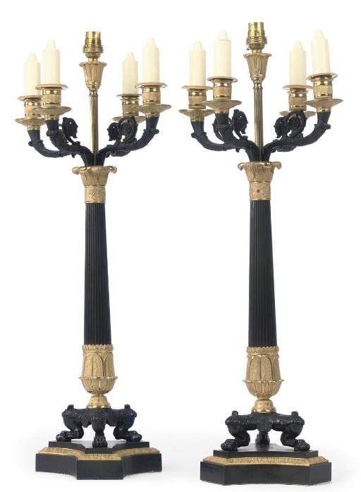 A PAIR OF PATINATED BRONZE AND GILT METAL FIVE LIGHT CANDELABRA