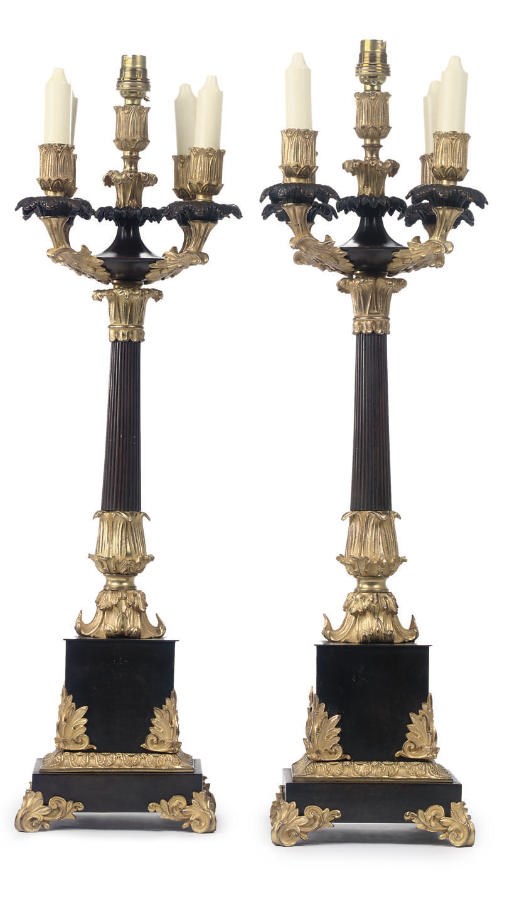 A PAIR OF RESTAURATION PATINATED AND GILT BRONZE FIVE-LIGHT CANDELABRA