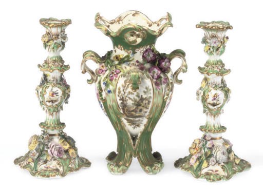 AN ENGLISH GREEN-GROUND TWO-HANDLED VASE AND A PAIR OF CANDLESTICKS