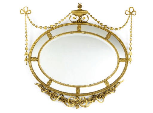 A LATE VICTORIAN GILT-COMPOSITION MIRROR