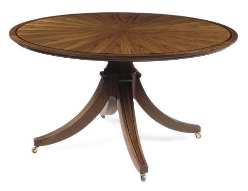 A WALNUT CIRCULAR DINING TABLE