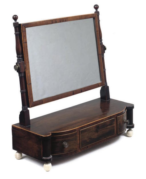 A REGENCY ROSEWOOD BOWFRONT DRESSING MIRROR