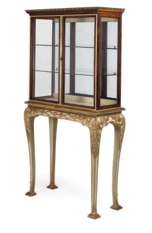 A WALNUT AND PARCEL GILT GLAZED CABINET ON STAND