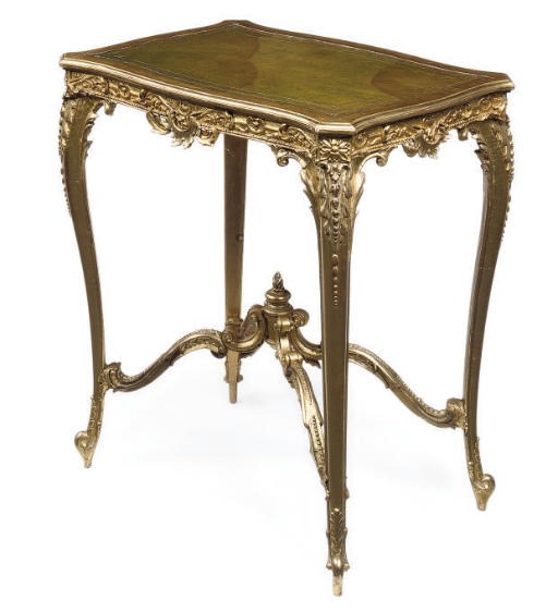 A LATE VICTORIAN GILT COMPOSITION WRITING TABLE