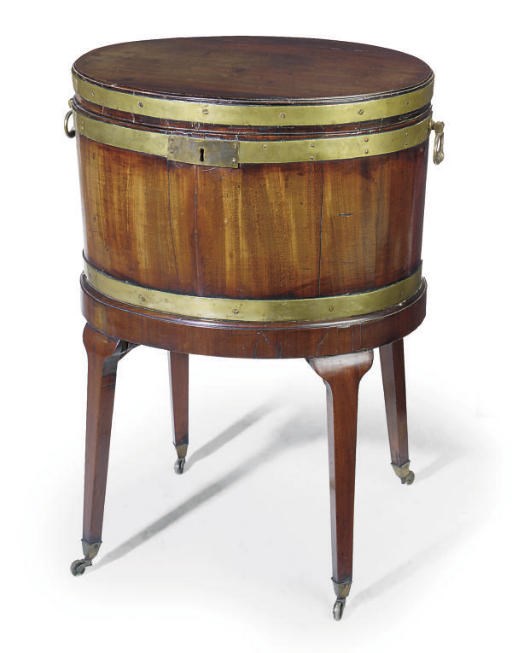 A GEORGE III MAHOGANY AND BRASS BOUND OVAL CELLARETTE