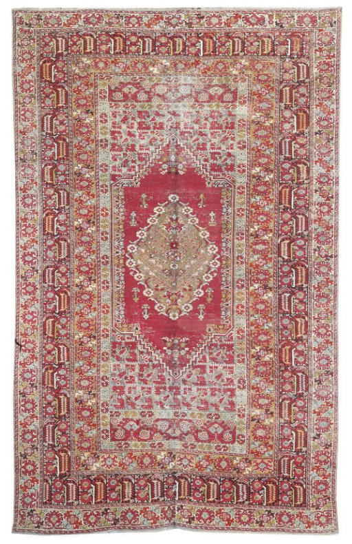 An antique Ghiordes large rug