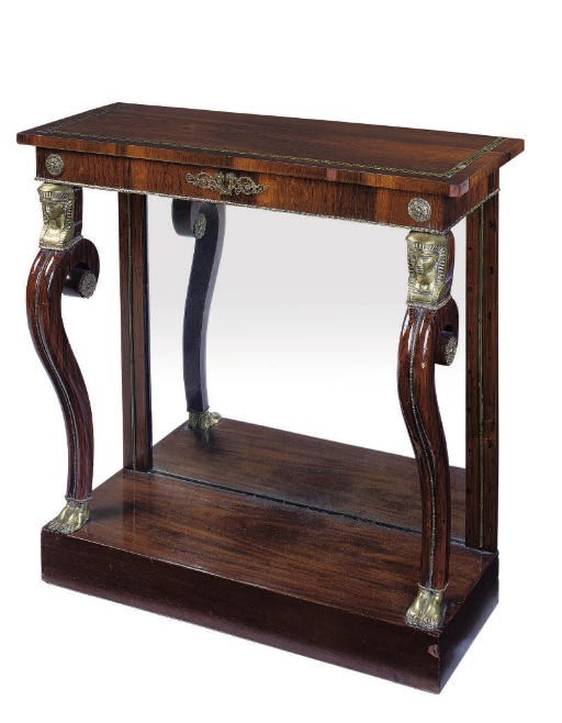A REGENCY ROSEWOOD AND BRASS INLAID CONSOLE TABLE