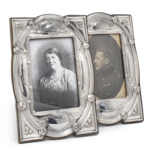 A PAIR OF ART NOUVEAU SILVER PHOTOGRAPH FRAMES