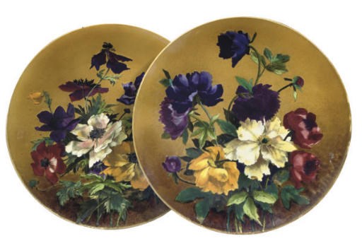 A PAIR OF VILLEROY AND BOCH (METTLACH) POTTERY CHARGERS