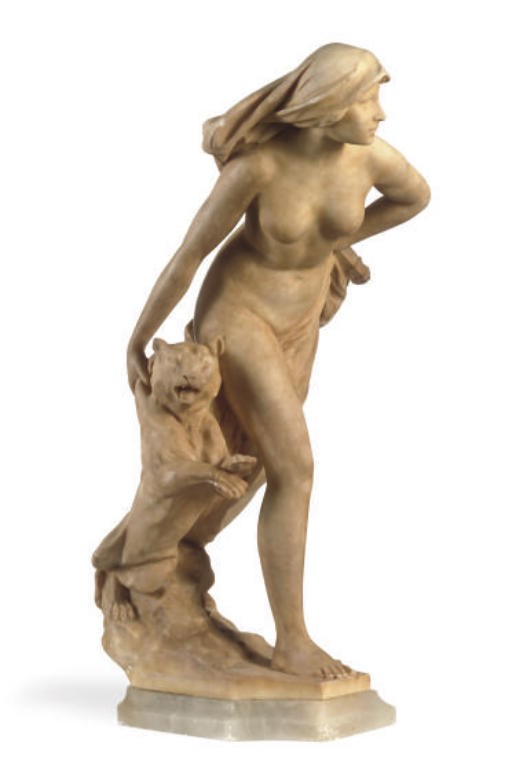 A CONTINENTAL TINTED ALABASTER GROUP OF A HUNTRESS WITH A TIGER