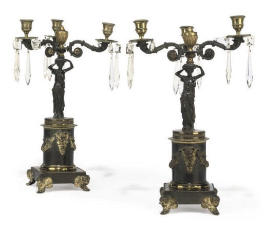 A PAIR OF REGENCY GILT AND PATINATED BRONZE THREE-LIGHT CANDELABRA