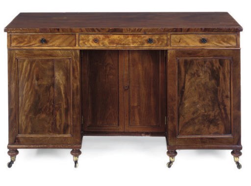 A REGENCY MAHOGANY KNEEHOLE WRITING DESK