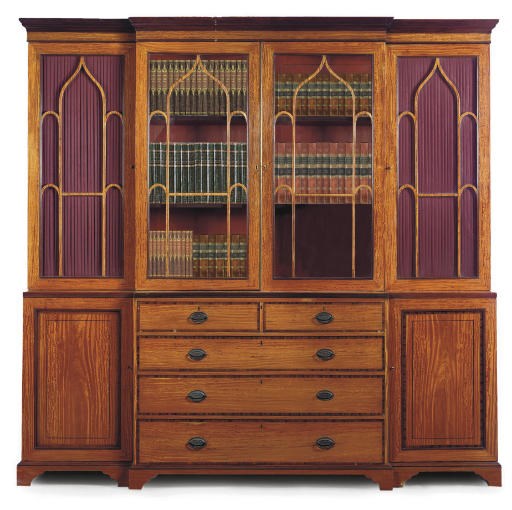 AN EDWARDIAN SATINWOOD AND ROSEWOOD CROSSBANDED BREAKFRONT SECRETAIRE BOOKCASE