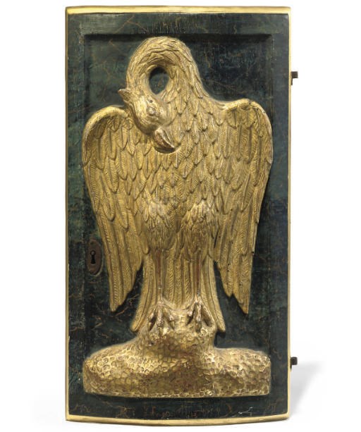 AN AUSTRIAN RELIEF CARVED GILTWOOD AND PAINTED FAUX MARBLE DOOR PANEL