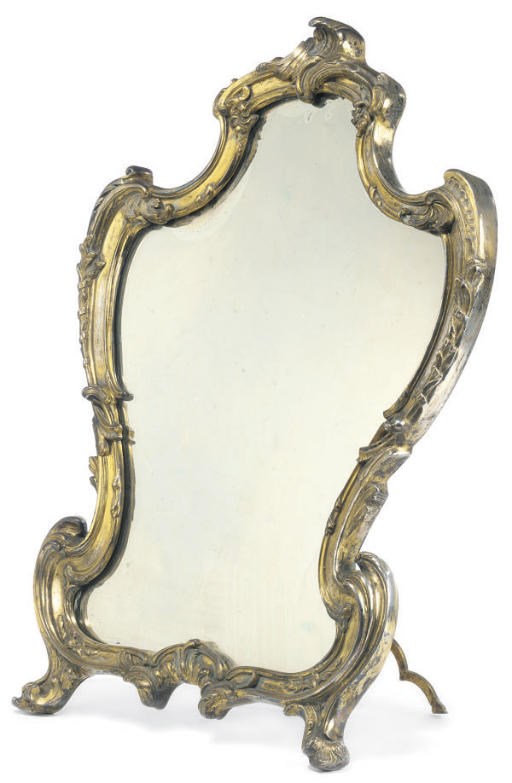 A SILVERED AND GILT-METAL DRESSING TABLE MIRROR
