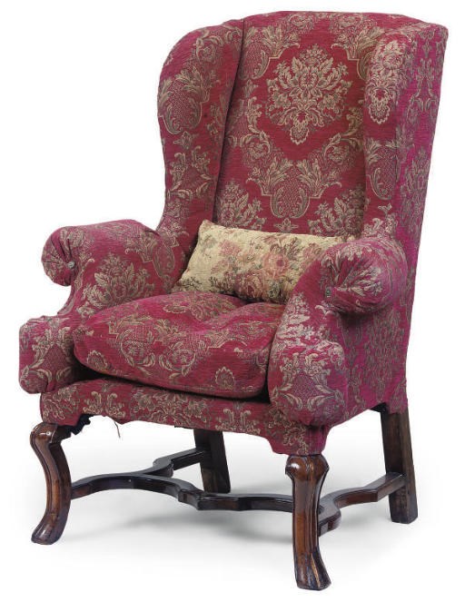 A WALNUT-FRAMED WING ARMCHAIR