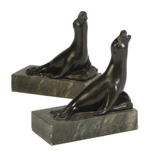 A PAIR OF PATINATED SPELTER BOOKENDS