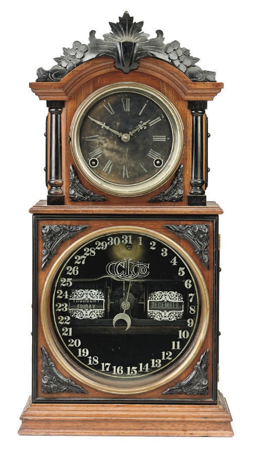 An American ebonised and walnut perpetual calendar mantel clock
