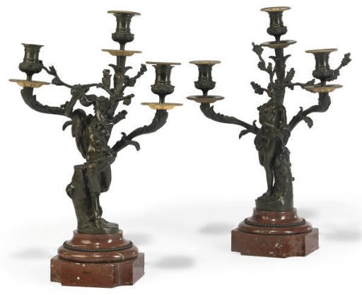 A PAIR OF FRENCH GILT AND PATINATED BRONZE FIGURAL THREE-LIGHT CANDELABRA