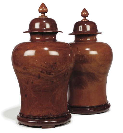 A PAIR OF SOUTH-EAST ASIAN LARGE TURNED HARDWOOD URNS AND COVERS