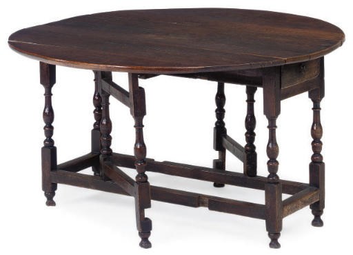 AN OAK GATELEG TABLE