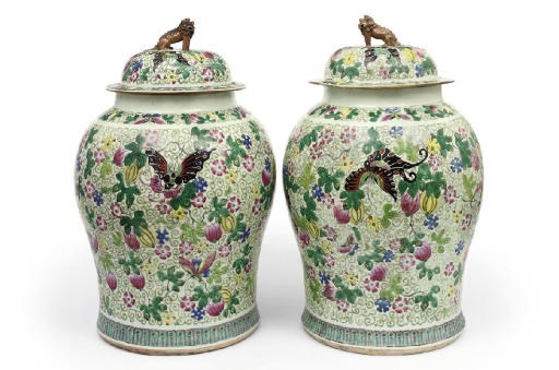 A pair of Chinese famille rose temple jars and covers