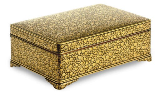A JAPANESE GILT-OVERLAID BOX WITH HINGED COVER DECORATED IN OVERALL LEAF DESIGN,