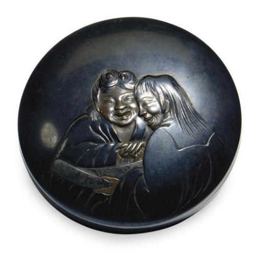 A JAPANESE PATINATED METAL CIRCULAR BOX AND COVER WITH KANZAN AND JITTOKU,