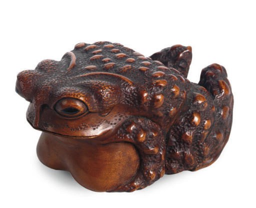A JAPANESE WOOD MODEL OF A TOAD,