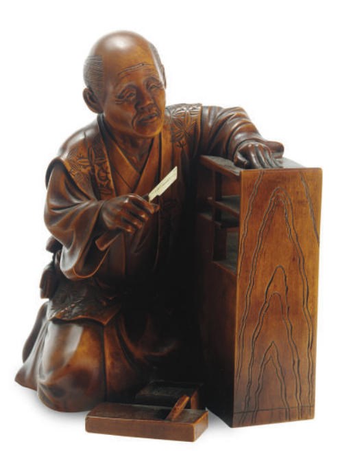 A JAPANESE WOOD CARVING OF A CARPENTER,**