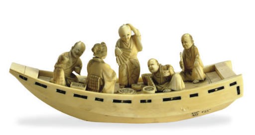 A JAPANESE IVORY MODEL OF FIGURES IN A BOAT,**