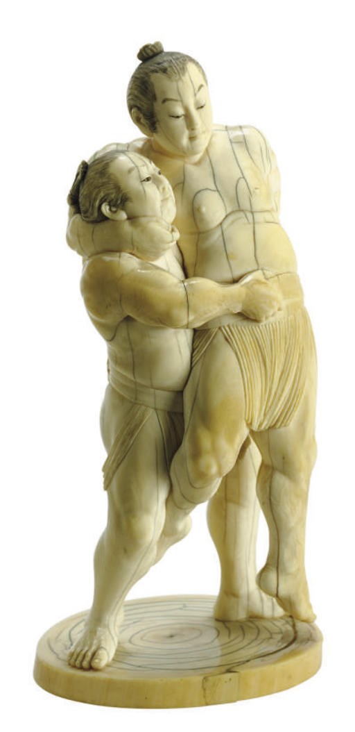 A JAPANESE IVORY CARVING OF TWO SUMO WRESTLERS,**
