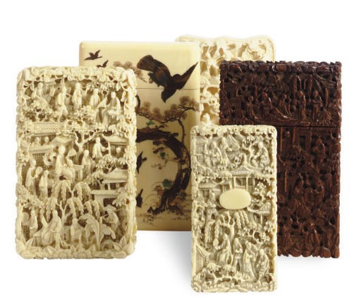 A GROUP OF SIX CHINESE AND JAPANESE IVORY CARD HOLDERS AND A WOOD CARD HOLDER,