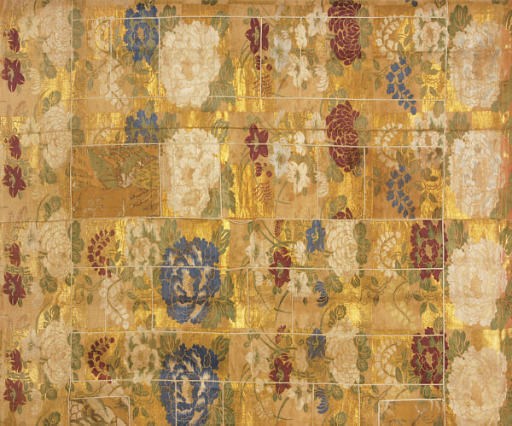 A JAPANESE EMBROIDERED SILK AND GILT THREAD BROWN GROUND PANEL WITH LARGE PEONIES AND WISTERIA,