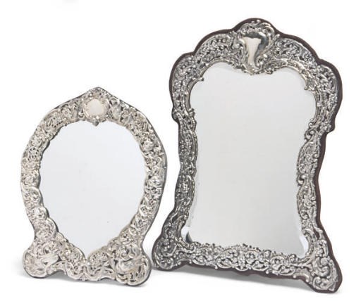 AN EDWARD VII SILVER DRESSING MIRROR AND AN AMERICAN SILVER DRESSING MIRROR,