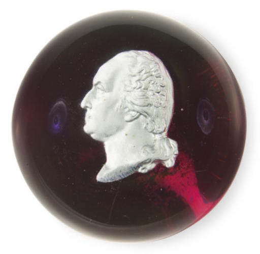 A SULPHIDE RUBY-GROUND GLASS PAPERWEIGHT,