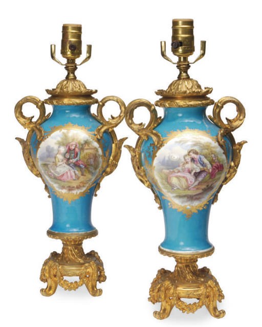 A PAIR OF GILT METAL-MOUNTED SÈVRES STYLE BALUSTER VASES MOUNTED AS LAMPS,
