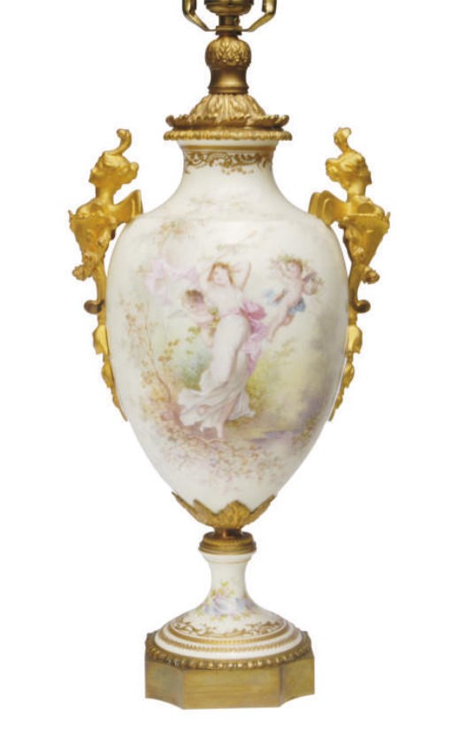 A GILT METAL-MOUNTED SÈVRES STYLE WHITE GROUND BALUSTER VASE MOUNTED AS A LAMP,