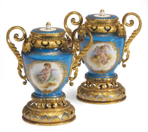 A PAIR OF ORMOLU-MOUNTED SÈVRES STYLE TURQUOISE-GROUND PORCELAIN VASES AND COVERS,