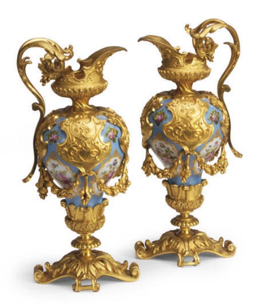 A PAIR OF GILT-BRONZE MOUNTED SÈVRES-STYLE LIGHT BLUE-GROUND PORCELAIN EWERS,