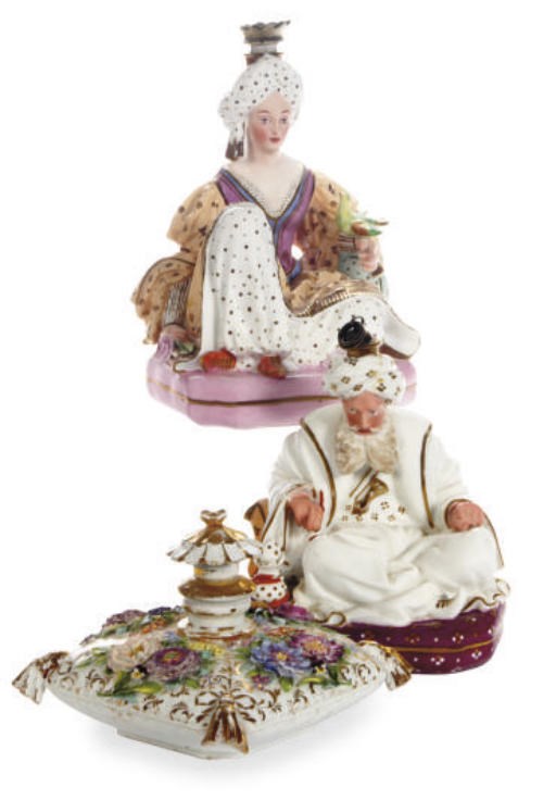A PAIR OF FRENCH PORCELAIN SCENT BOTTLES AND STOPPERS MODELED AS A SULTAN AND SULTANA AND A GERMAN CUSHION-SHAPED SCENT BOTTLE AND STOPPER,