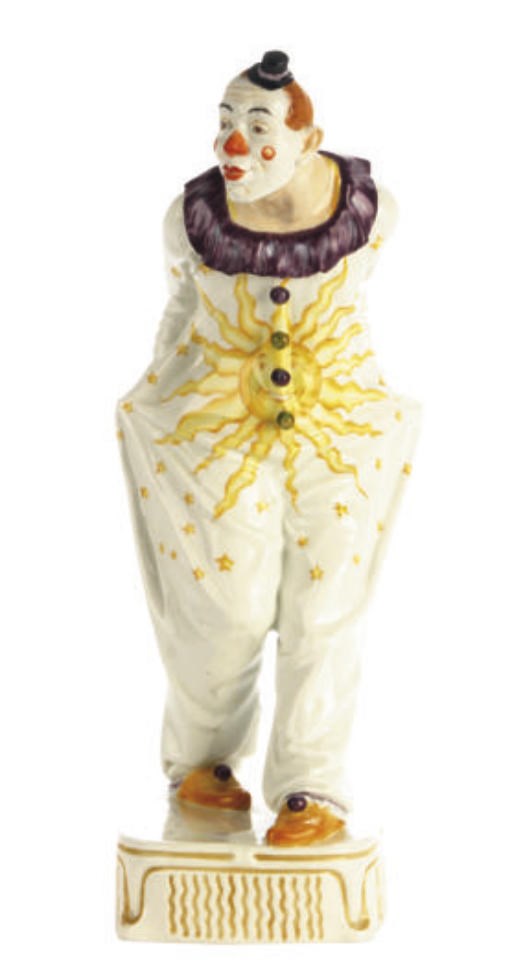 A GERMAN PORCELAIN FIGURE OF A CLOWN,
