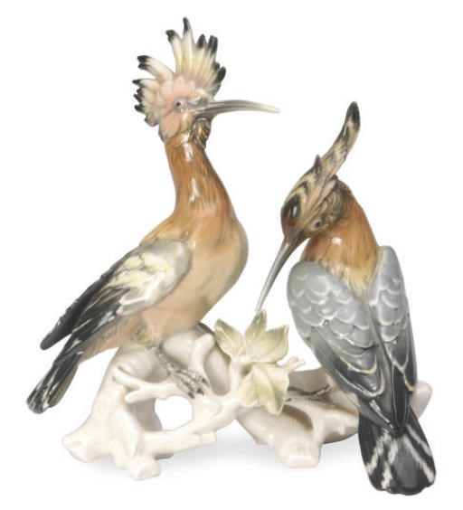 A GERMAN PORCELAIN MODEL OF A PAIR OF HOO-POO BIRDS ON A BRANCH,