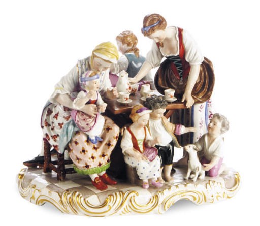 A VIENNA-STYLE PORCELAIN GROUP OF A FAMILY AT THE TABLE,