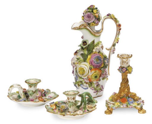 AN ENGLISH PORCELAIN FLOWER-ENCRUSTED JUGLET AND STOPPER AND TWO SIMILAR CHAMBERSTICKS,