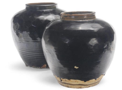 A POSSIBLY CHINESE PAIR OF BLACK GLAZED BALUSTER JARS