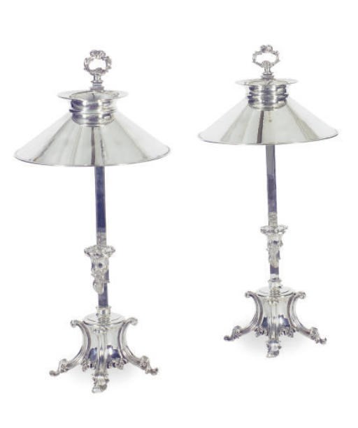 A PAIR OF CHROMED-METAL ADJUSTABLE CANDLEHOLDERS,