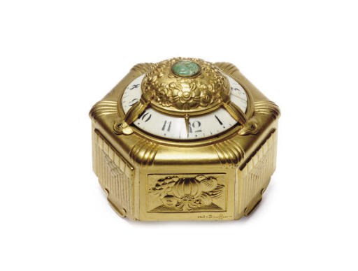 A FRENCH ART DECO GILT-BRONZE DESK CLOCK**,