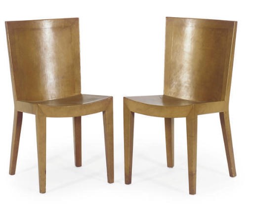 A PAIR OF TAN LEATHER SIDE CHAIRS,