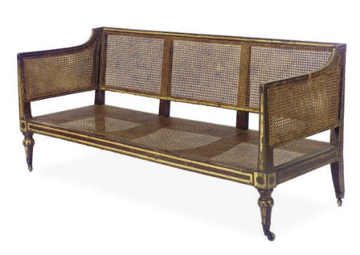 A REGENCY ROSEWOOD-GRAINED, PARCEL-GILT AND CANED SOFA,